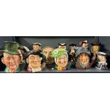 A collection of large Royal Doulton and other character jugs.