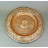 A large 19th Century Elkington silvered copper charger lavishly decorated with classical figures,