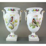 A pair of Continental porcelain vases decorated with birds, H. 35cm.