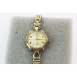 A lady's 9ct gold Rotary wristwatch with a gold plated strap.