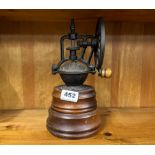 A cast iron and wood spice grinder, H. 25cm.