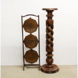 A turned beechwood pedestal plant stand, H. 66cm, together with a folding oak cake stand.