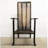 A rare 19th century Japanned and cane armchair with distinctive back support, H. 111cm.