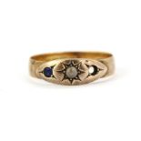 A hallmarked 18ct rose gold ring sapphire and seed pearl set ring, (P). One sapphire missing.