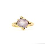 A hallmarked 9ct yellow gold rose quartz set crossover ring, (K).