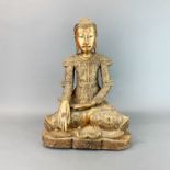 A Thai gilt carved wooden figure of a seated Buddha, H. 45cm.
