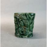 A Chinese carved jade/hardstone brush pot decorated with scholar's in a forest, H. 16cm.