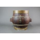 An unusual brass bound wooden barrell, W. 46cm, H. 36CM.