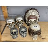 A group of six resin skulls, largest 18cm.