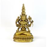 A Tibetan gilt bronze multi-arm and multi-head jewelled deity, H. 29cm.