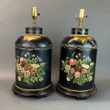 A pair of hand-painted toleware table lamps with attached wooden bases, H. 51cm.