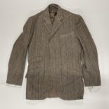An unfinished tailor made tweed jacket, lining incomplete. Shoulder W. 43cm.