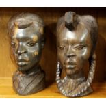 A pair of African carved figured ebony tribal busts, H. 28cm.