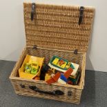 A basket of vintage Fisher Price toys.