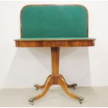 An early 19th C rosewood veneered pedestal fold out games table, W. 92cm.