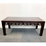 A Chinese carved hardwood low table, 112 x 46 x 46cm.
