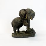 A bronzed resin figure of a bull elephant, H. 19cm.