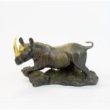 A Franklin Mint 'Thunder on the Plains' bronze figure of a rhino, H. 16cm. L. 28cm.