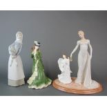 A Franklin Mint limited edition porcelain figure of 'Emma', H. 28cm. Together with a Lladro figure