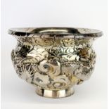 An embossed Oriental silver bowl decorated with dragons, Dia. 13.5cm. D. 9cm.