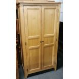 A modern light oak wardrobe, H. 170cm W. 90cm.