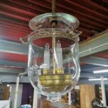 An interesting glass and brass light fitting.