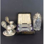Two hallmarked silver inkwells with a silver topped sugar shaker and a pair of silver mounted cut