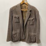 A gent's tailor made tweed jacket, shoulder W. 104cm. Well used.