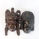 Two Indonesian carved hardwood masks, largest 30cm.