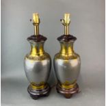 A pair of Chinese brass and pewter vases mounted as table lamps, H. 53cm. Some scratching to
