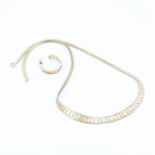 A 9ct tri colour gold necklace with a matching 9ct tri colour gold hoop earring.