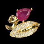 A gold on 925 silver ring set with a pear cut ruby and white stones, (N.5).