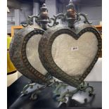 A pair of large heart shaped metal storm lanters, H. 52cm.