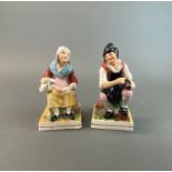 Two 19th Century Staffordshire figure of the cobbler and his wife, H. 17cm.