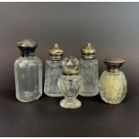 A group of five silver mounted bottles, tallest 10cm.