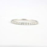 An 18ct white gold half eternity ring set with brilliant cut diamonds, (P).