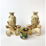 A pair of 19th Century Japanese Satsuma lion dog vases, H. 21cm. Both A/F. together with a