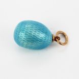 A Russian hallmarked 14ct gold and blue enamel egg pendant, L. 2.5cm.