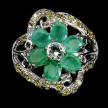 A 925 silver flower shaped ring set with oval cut emeralds and peridots, (O).