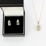 A 14ct yellow gold pendant set with an emerald cut citrine and diamonds on a 9ct gold chain, L.
