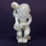 A Chinese carved celadon jade figure, H. 9cm.