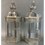 A pair of silvered metal hexagonal storm lanterns, H. 62cm.