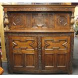 A superb 17th/early 18th century carved oak court cupboard, W. 160cm, H. 161cm.