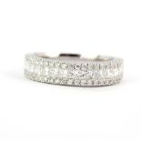 An 18ct white gold half eternity ring set with brilliant and princess cut diamonds, 1.22ct