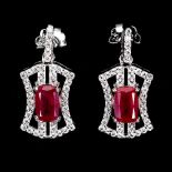 A pair of 925 silver drop earrings set with oval cut rubies and white stones, L. 1.9cm.