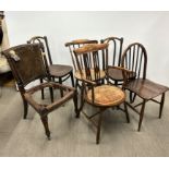 A group of six mixed chairs including a pair of bentwood chairs and an oak Ercol spindle back chair,