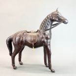 A handmade leather figure of a horse, H. 49cm.