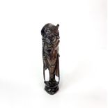 A mid-20th Century metal inlaid Chinese carved hardwood figure, H. 28cm.