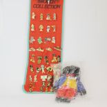 A collection of Golly badges and figure.