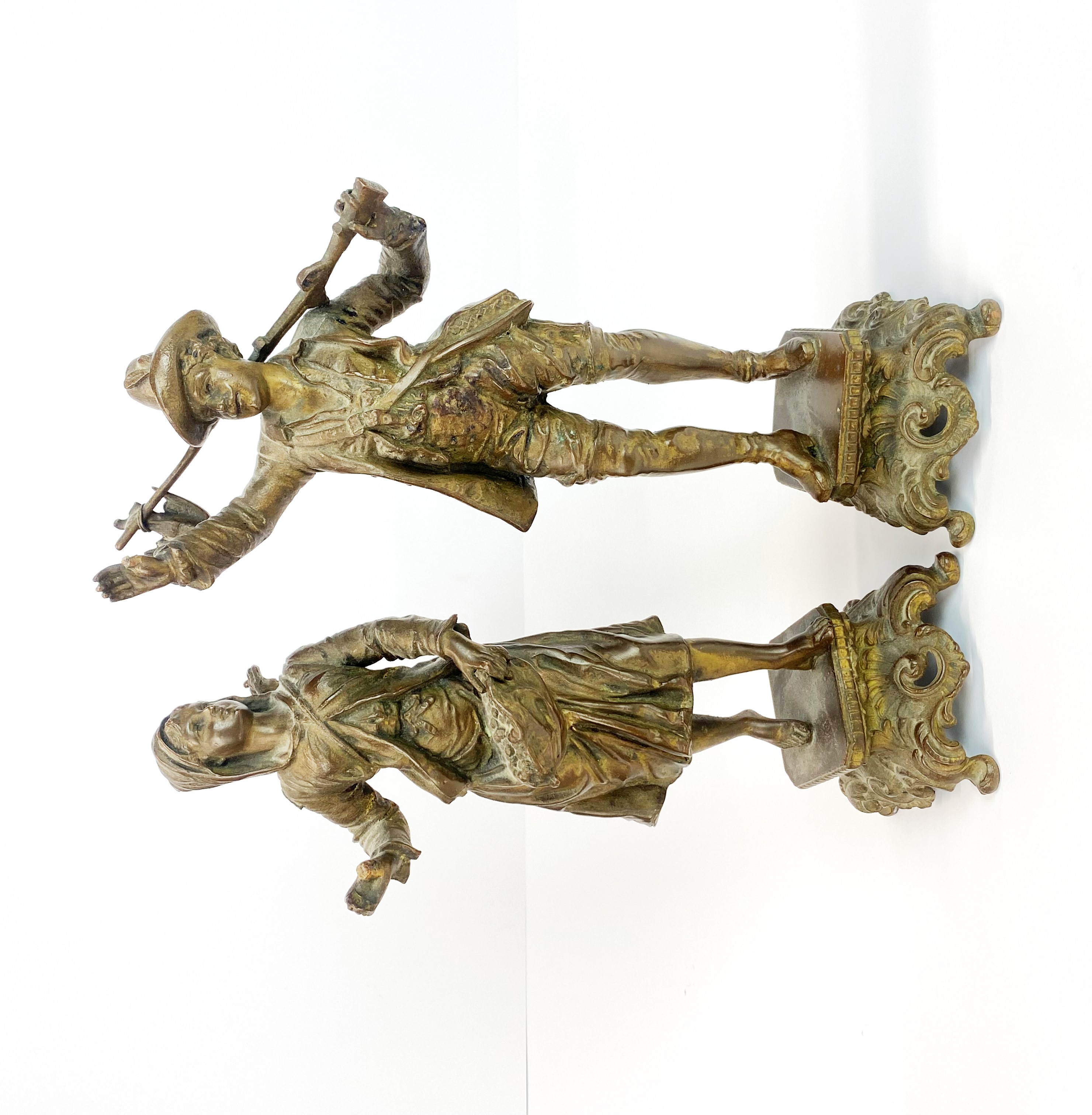A pair of 19th Century French bronze figures of peasant merchants, H. 28cm. Both A/F to thumbs.